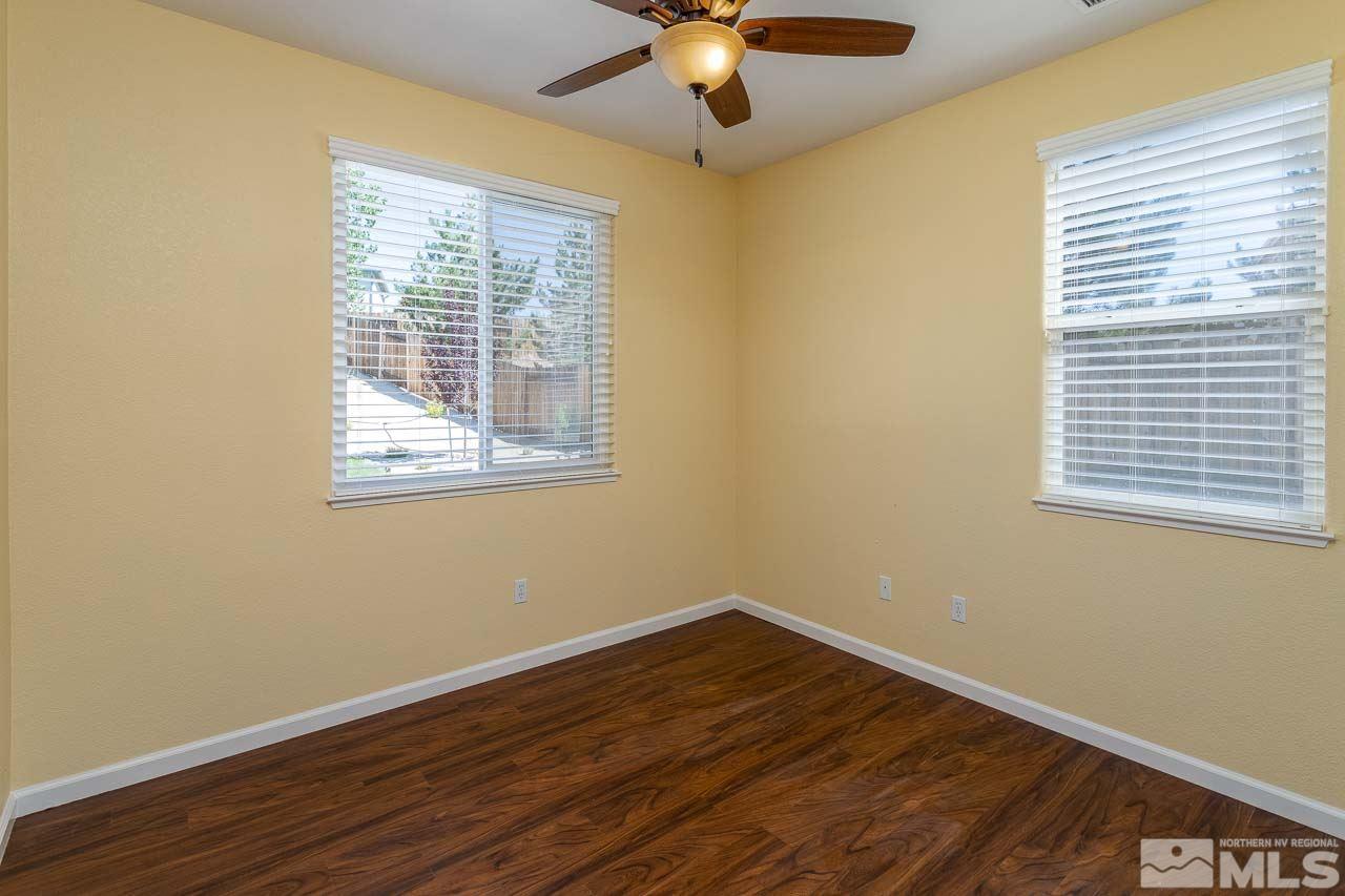 981 South University Reno, NV 89512 - Photo 8 of 19 a view of a room with wooden floor and windows