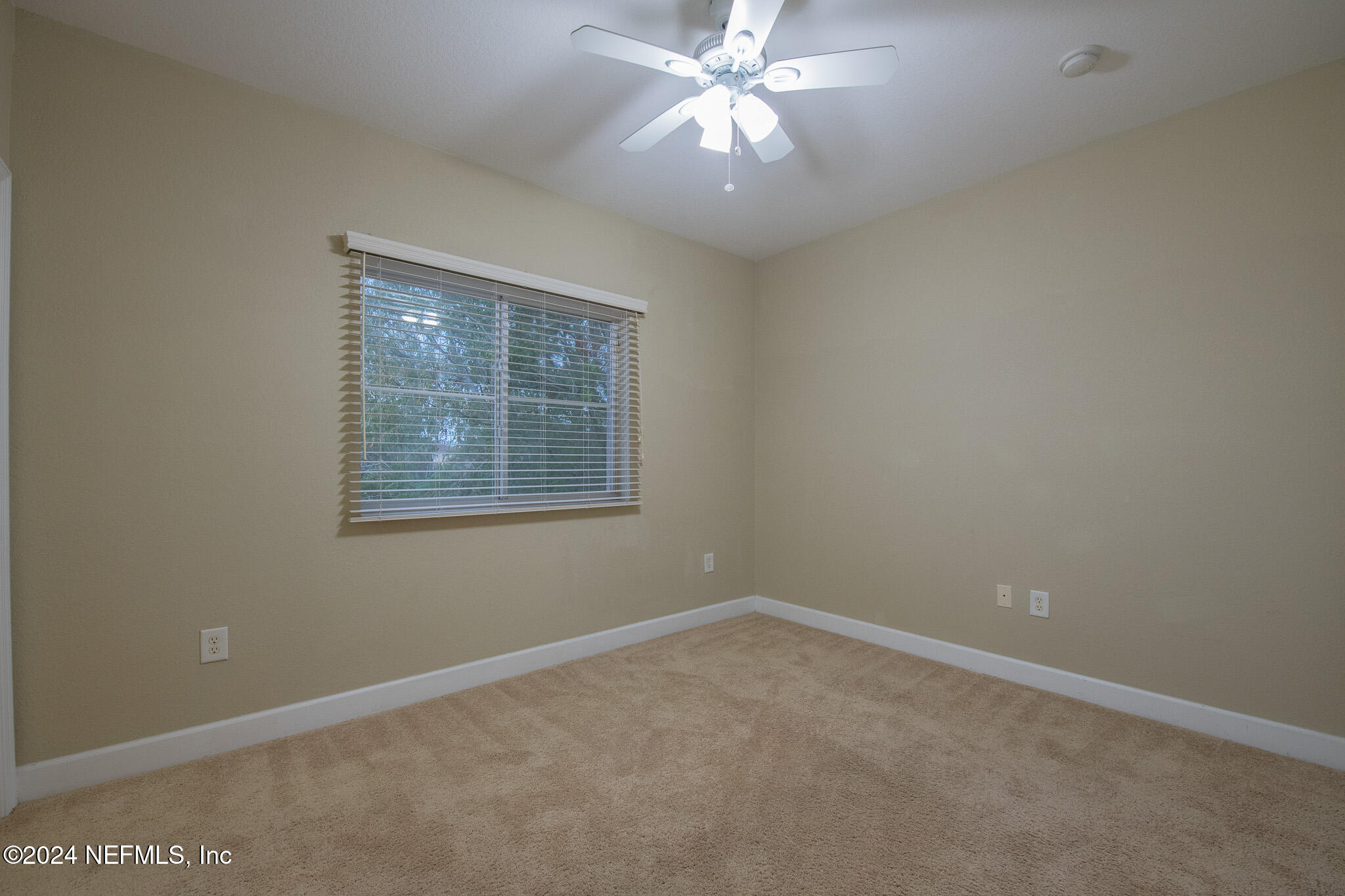 9745 Touchton Road, Unit 1922 Jacksonville, FL 32246 - Photo 13 of 26 an empty room with a window