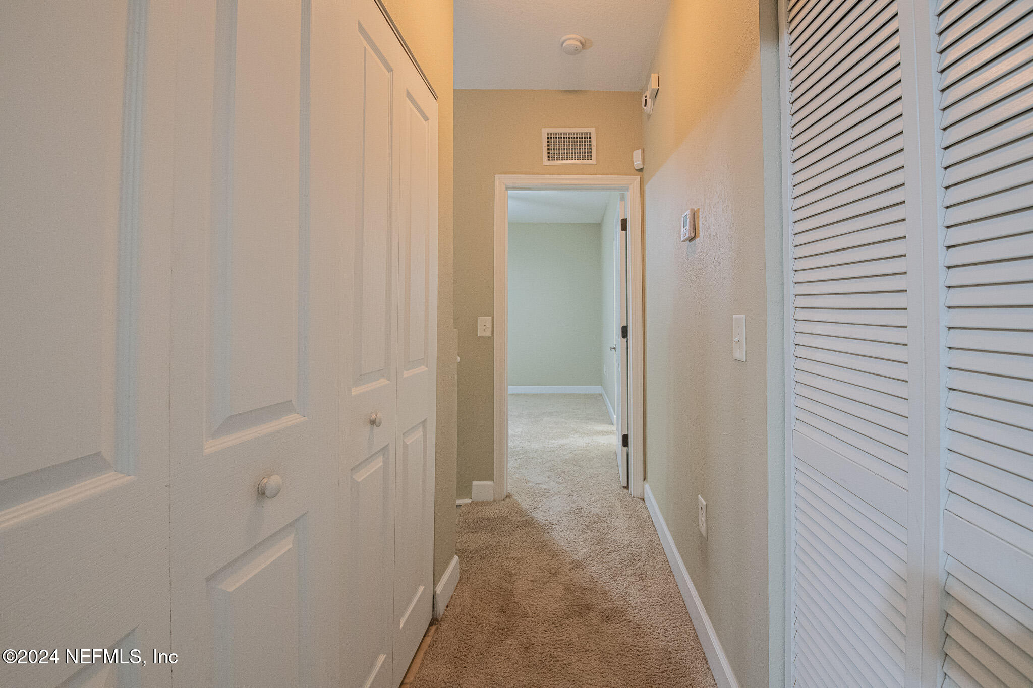 9745 Touchton Road, Unit 1922 Jacksonville, FL 32246 - Photo 17 of 26 a bathroom with a sink and a mirror
