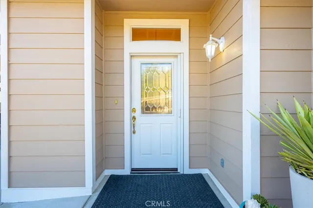 a kitchen with a sink and chairs