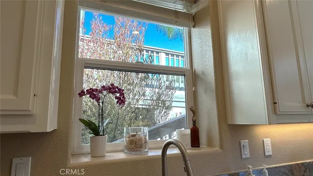 a bedroom with a bed couch and a window