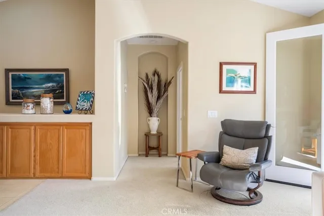 a view of a patio with a table and chairs under an umbrella
