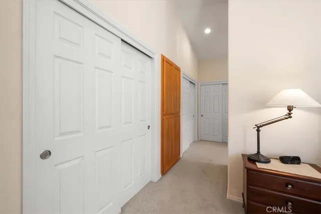 a view of house with backyard and sitting area