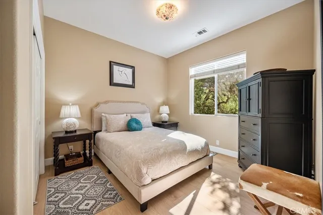 a view of balcony with chairs and wooden fence