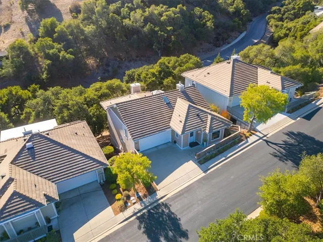 a view of a backyard with sitting area