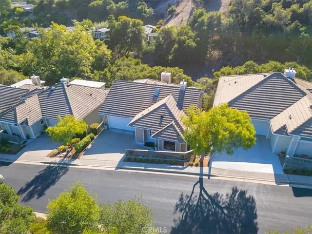 an aerial view of a house with yard swimming pool and outdoor seating