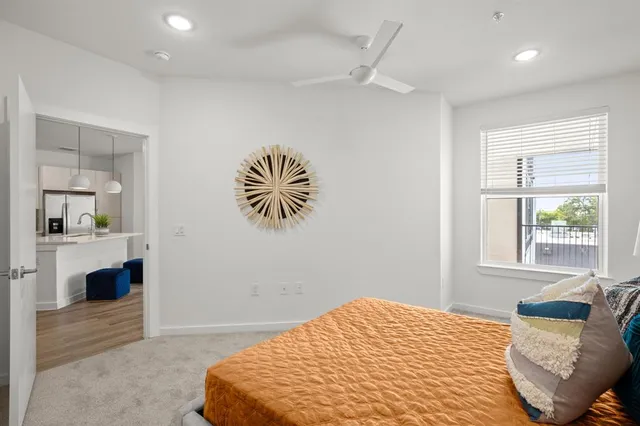 a bedroom with a bed and window