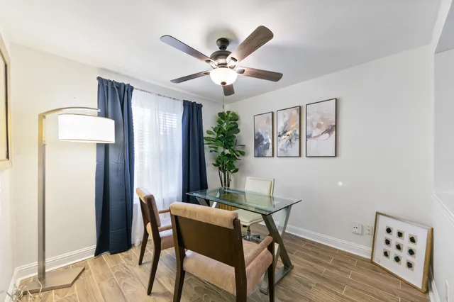 a dining room with furniture and window