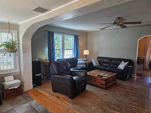 a living room with furniture and a window