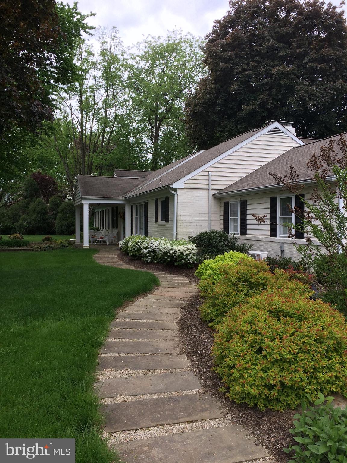 591 General Scott Road Wayne, PA 19087 - Photo 2 of 6 a front view of a house with garden
