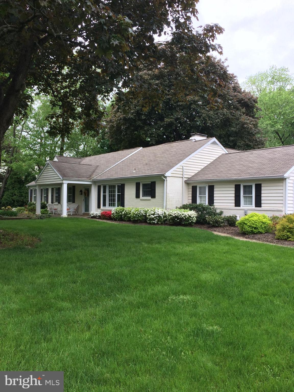 591 General Scott Road Wayne, PA 19087 - Photo 3 of 6 a front view of a house with a garden