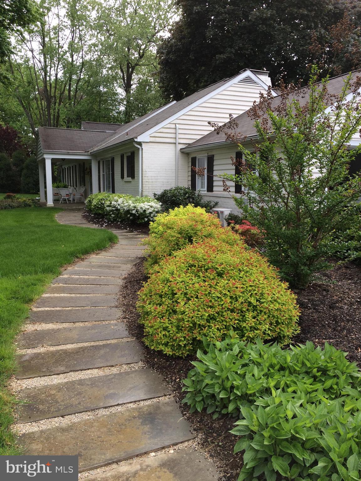 591 General Scott Road Wayne, PA 19087 - Photo 5 of 6 a front view of a house with garden