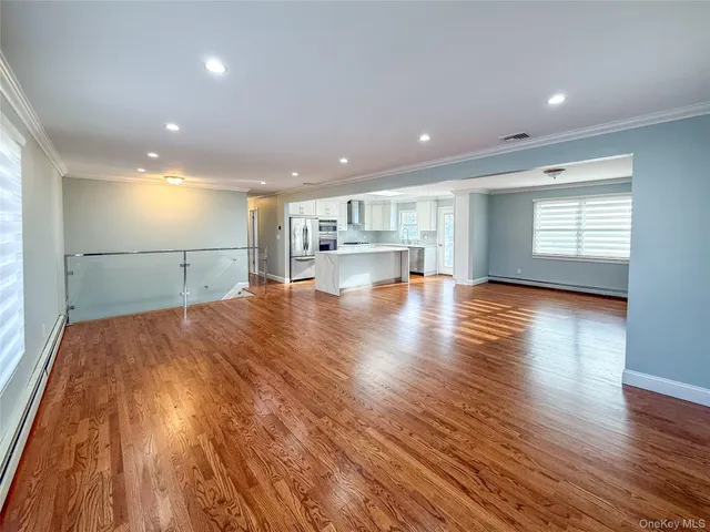 a view of a kitchen with a sink and a stove top oven