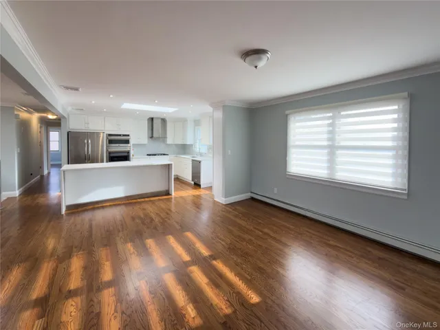 a kitchen with a sink stove top oven and cabinets
