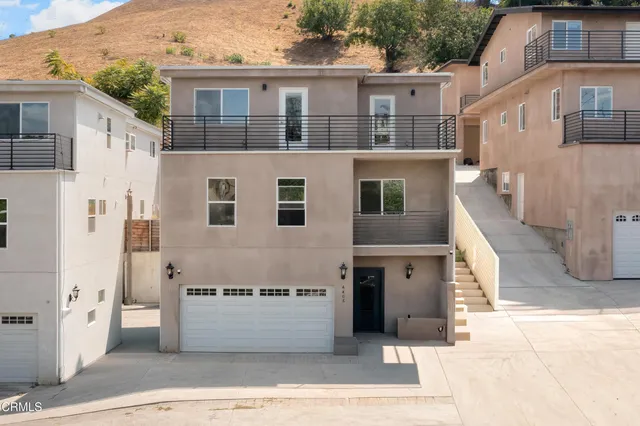 a front view of a building with large windows