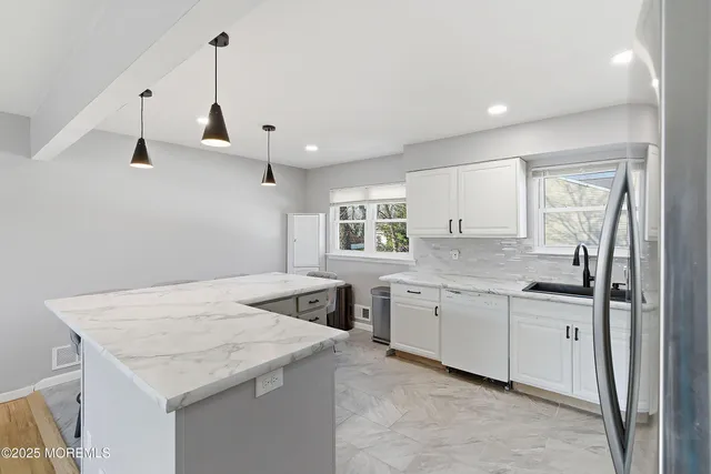 a bedroom with a bed and a ceiling fan