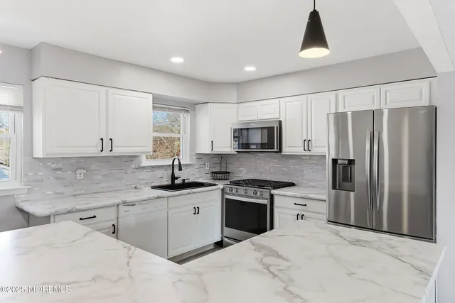 a bedroom that has a bed and a window in it