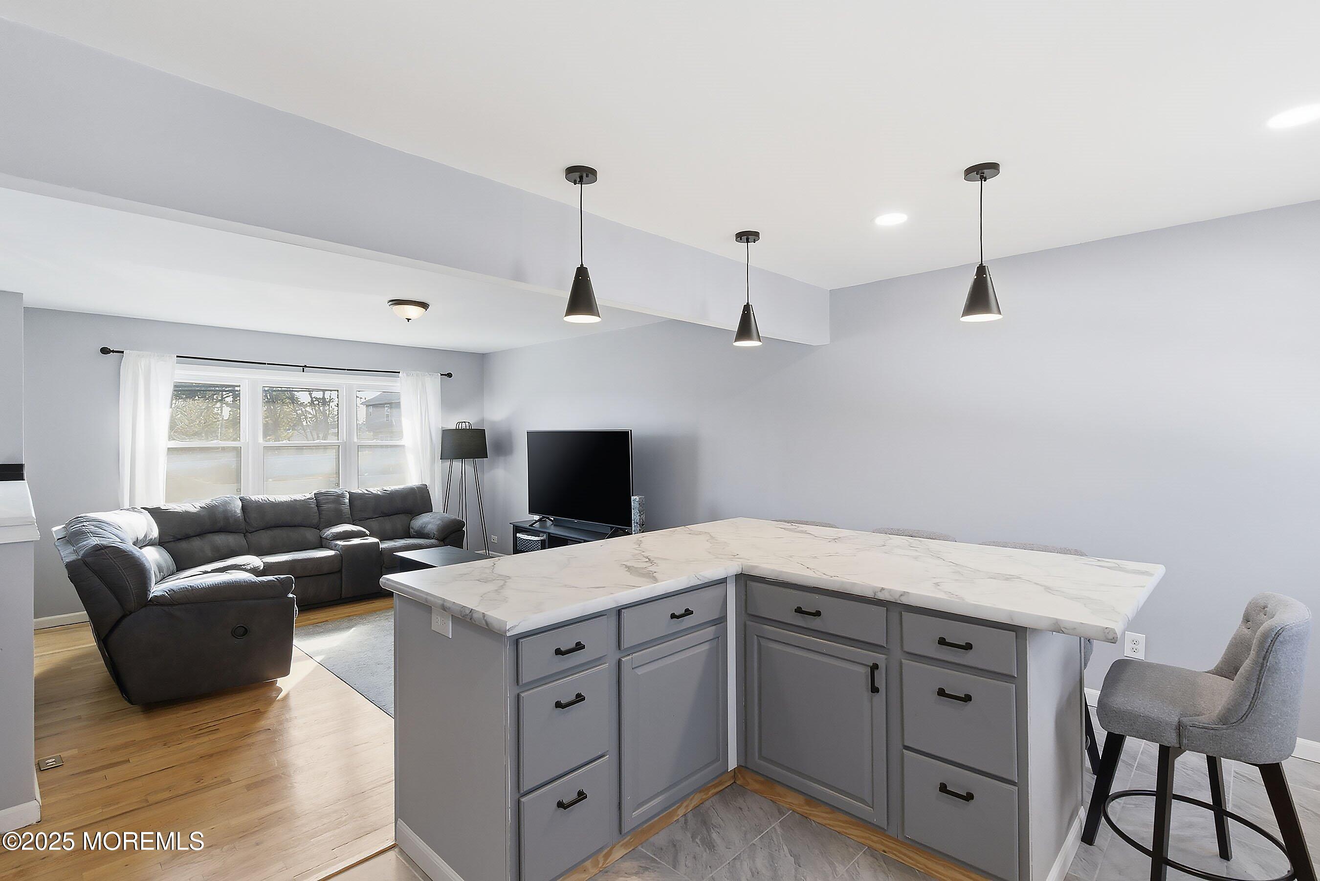 2178 Lanes Mill Road Brick, NJ 08724 - Photo 14 of 34 a living room with furniture and a flat screen tv
