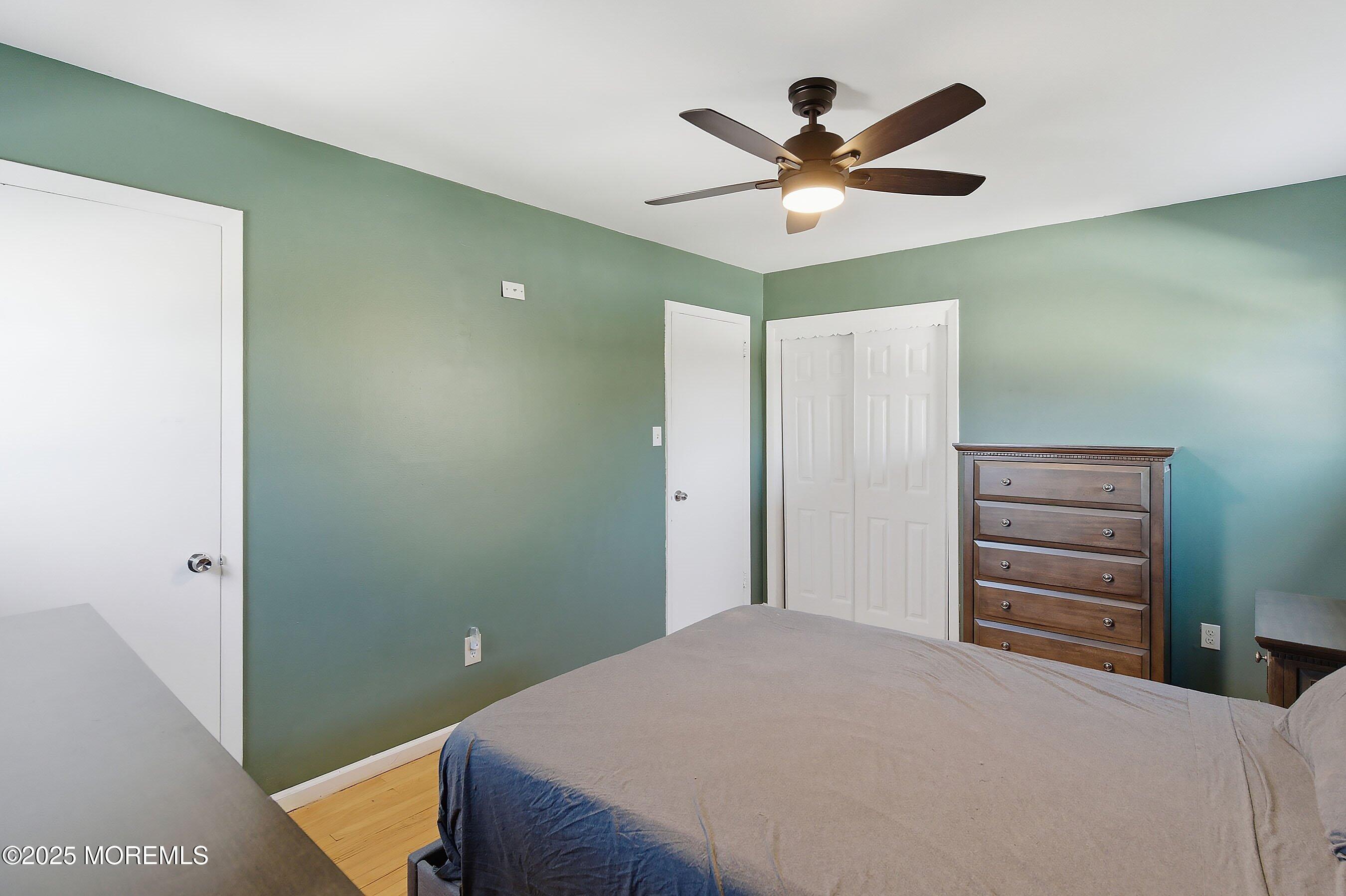 2178 Lanes Mill Road Brick, NJ 08724 - Photo 18 of 34 a bedroom with a bed and a ceiling fan