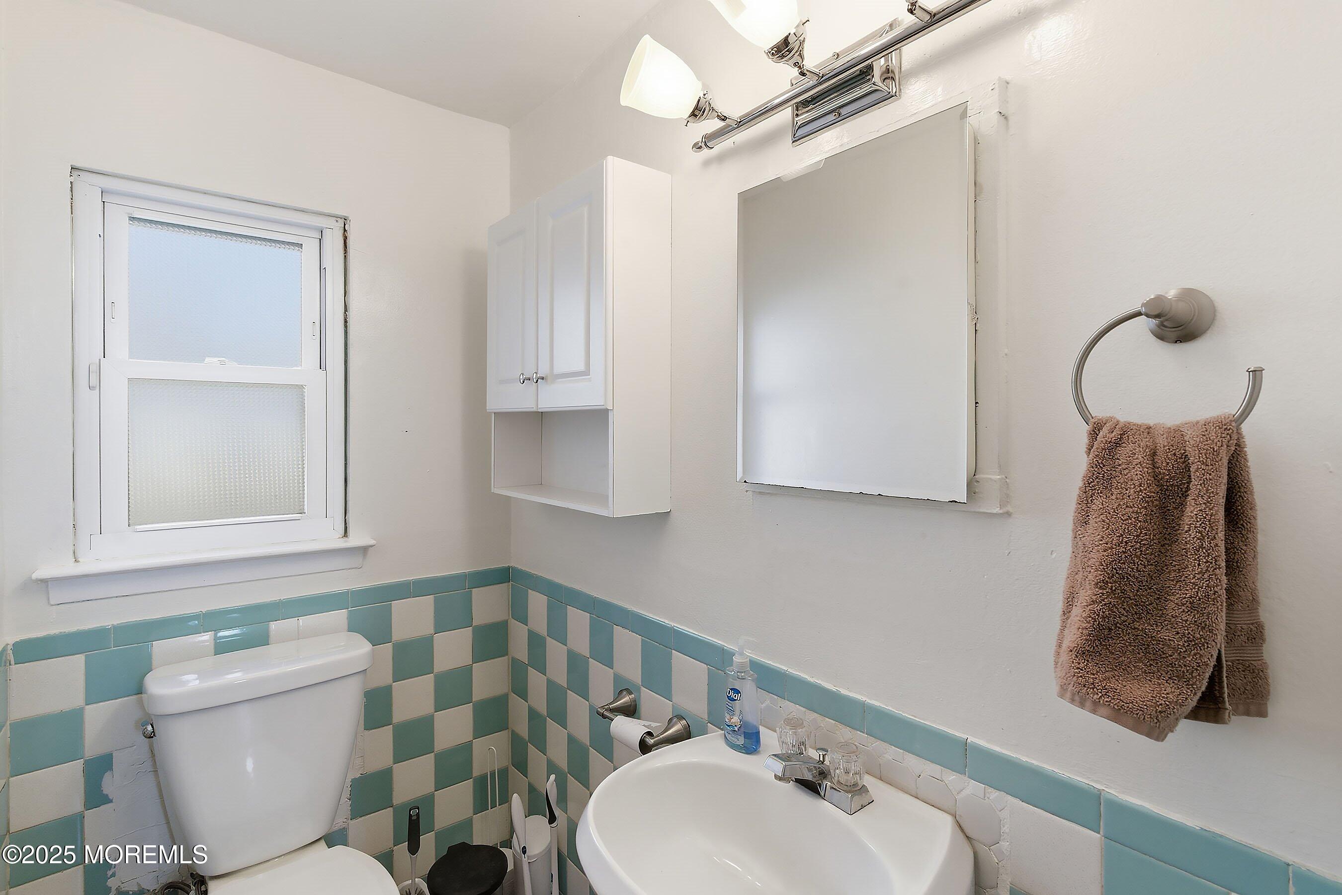 2178 Lanes Mill Road Brick, NJ 08724 - Photo 22 of 34 a bathroom with a sink a toilet and shower