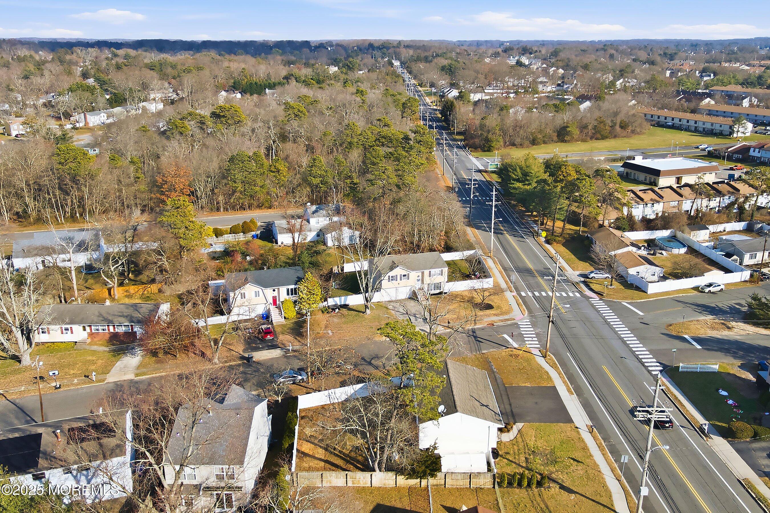 2178 Lanes Mill Road Brick, NJ 08724 - Photo 31 of 34 an aerial view of residential building and parking space
