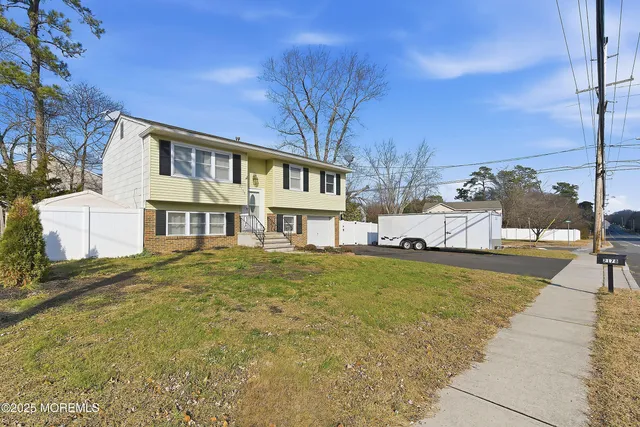 a view of a house with a street