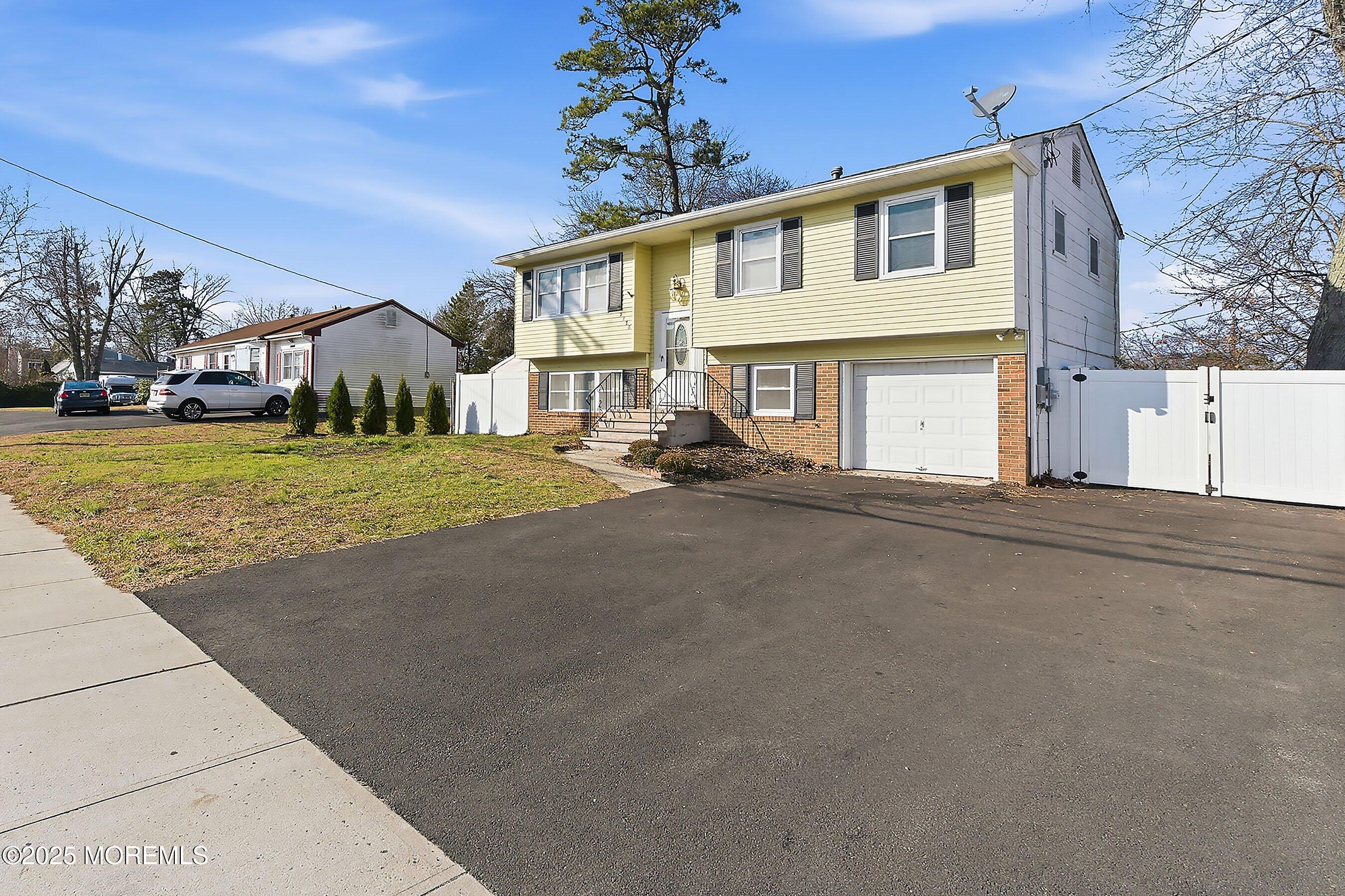 2178 Lanes Mill Road Brick, NJ 08724 - Photo 6 of 34 a view of a house with a street