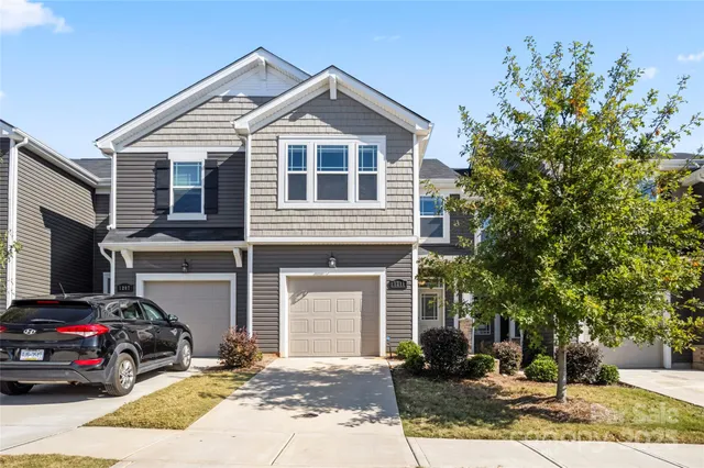 a view of a car park in front of house