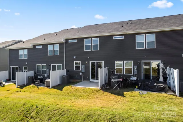 a house view with swimming pool in front of it
