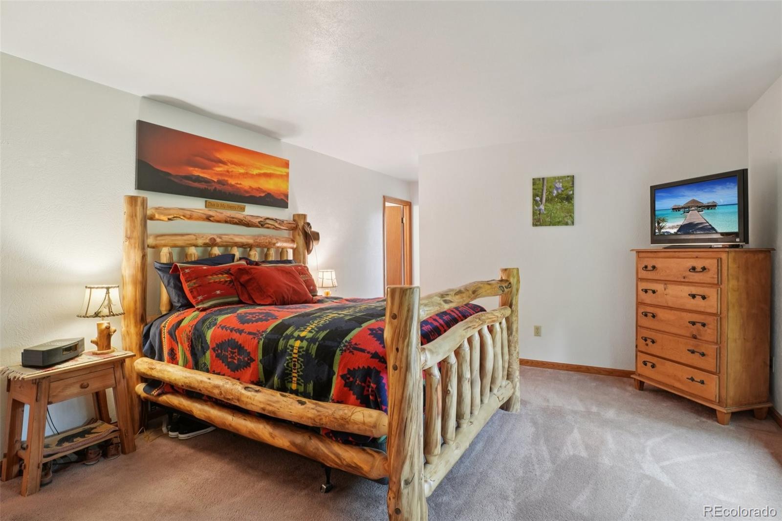 42 Catamount Ridge Road Bailey, CO 80421 - Photo 11 of 36 a bedroom with furniture and a baby crib