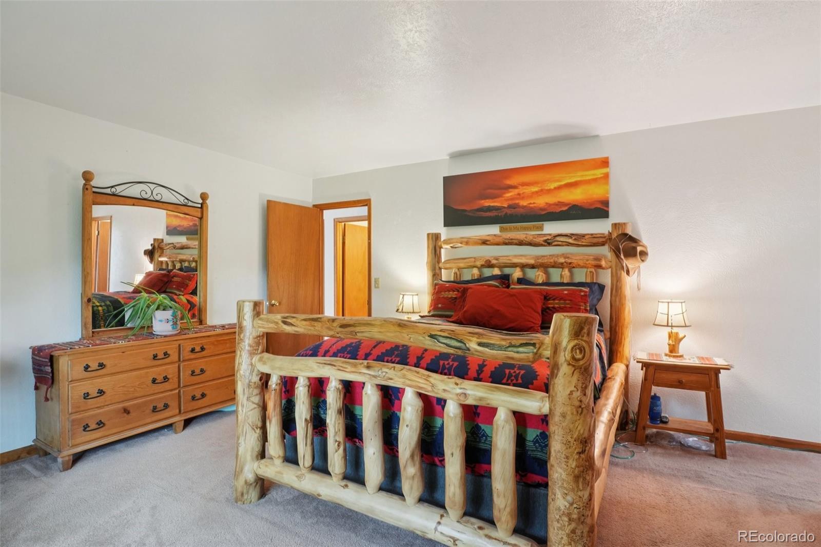 42 Catamount Ridge Road Bailey, CO 80421 - Photo 12 of 36 a bedroom with furniture and a window