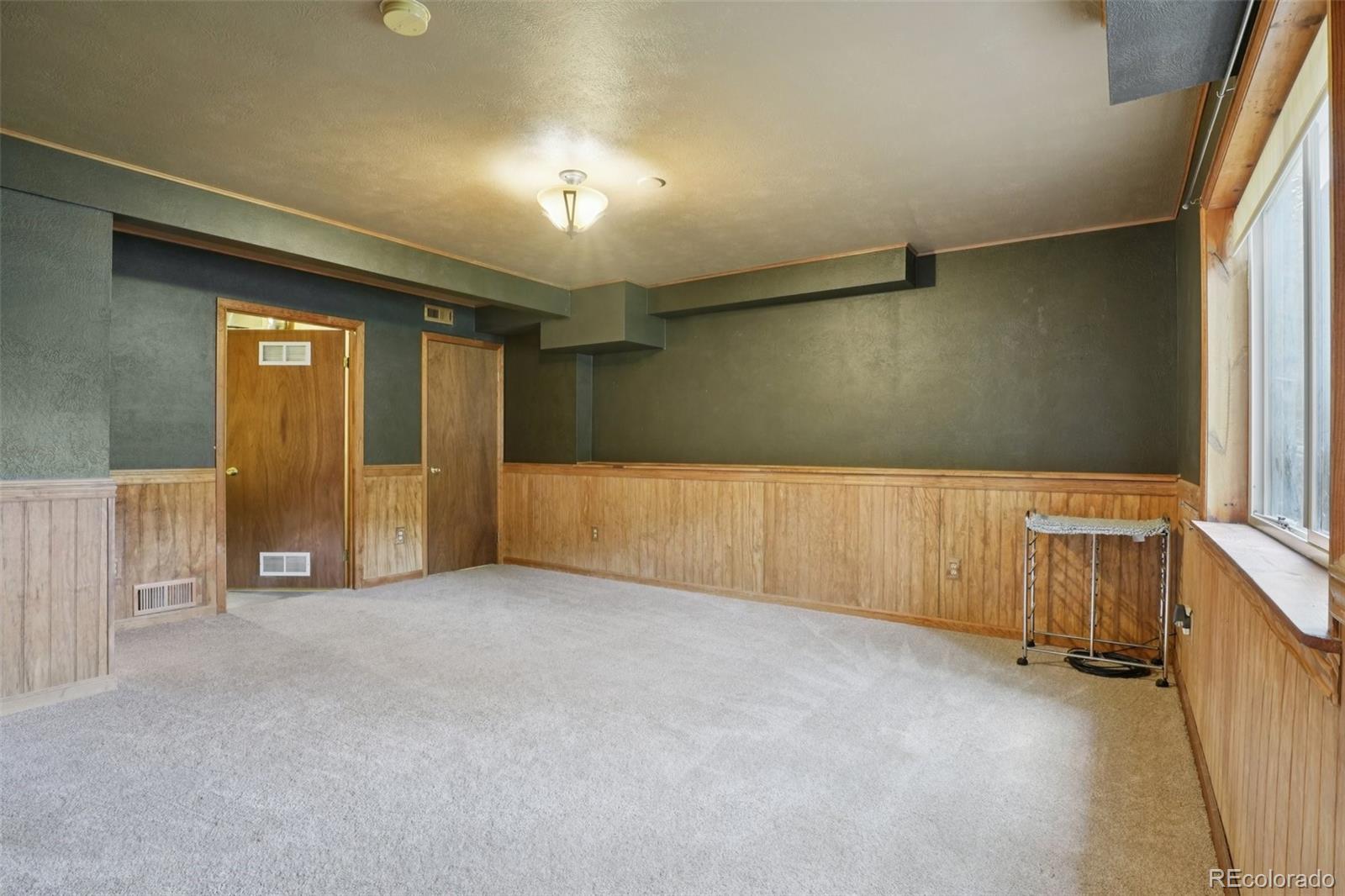 42 Catamount Ridge Road Bailey, CO 80421 - Photo 17 of 36 an empty room with windows