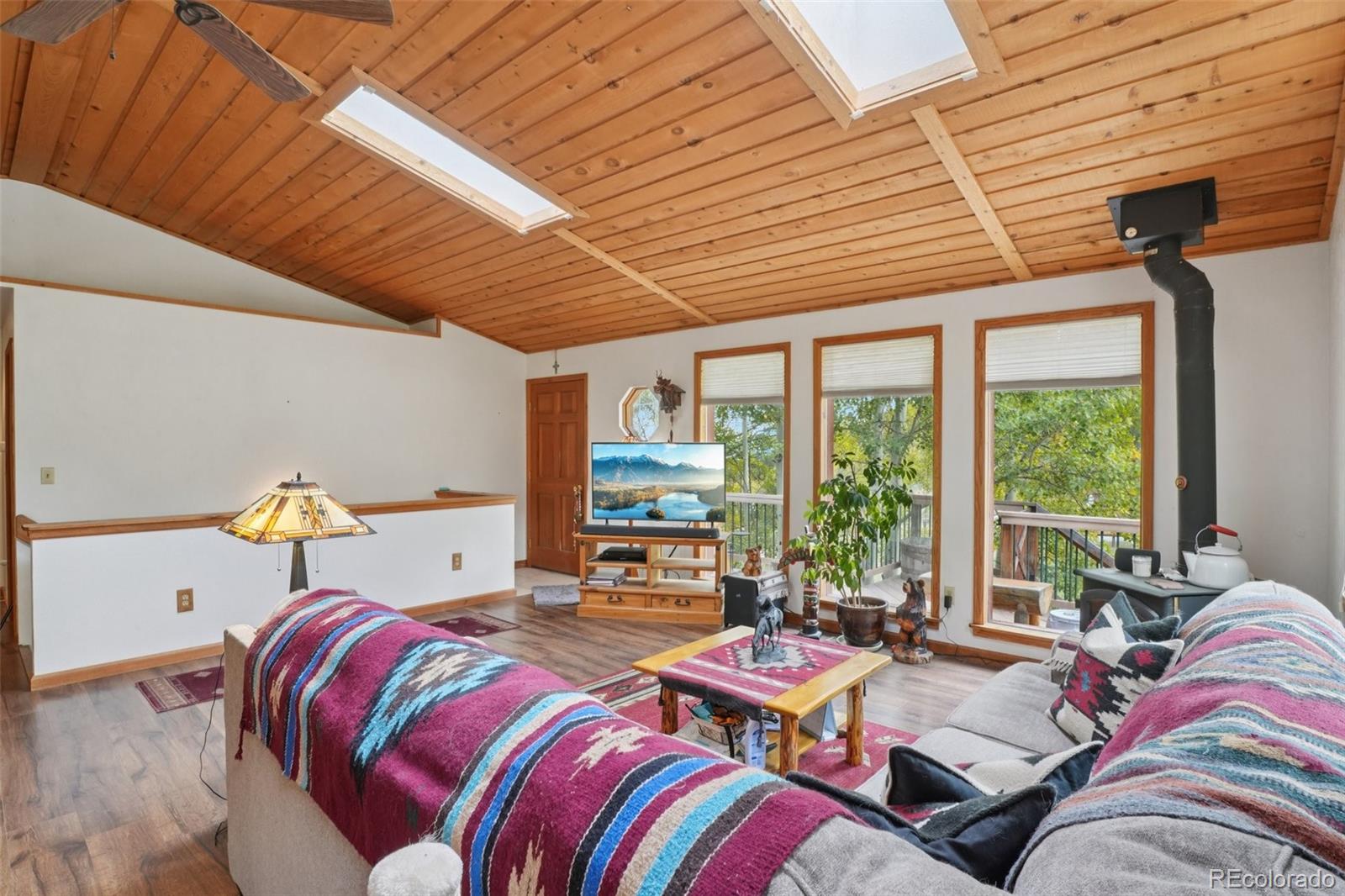42 Catamount Ridge Road Bailey, CO 80421 - Photo 4 of 36 a bedroom with furniture and a large window