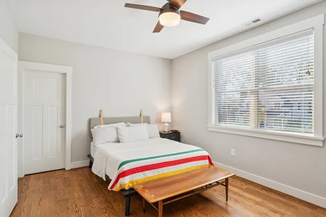 a bedroom with a bed and window