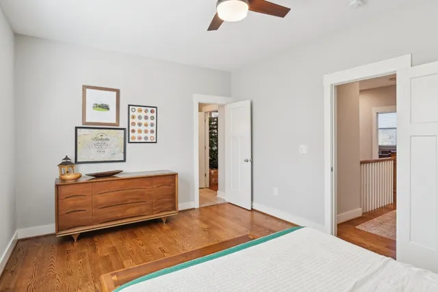 a bedroom with a bed and a dresser