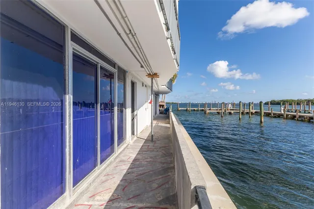 a view of a balcony with wooden floor