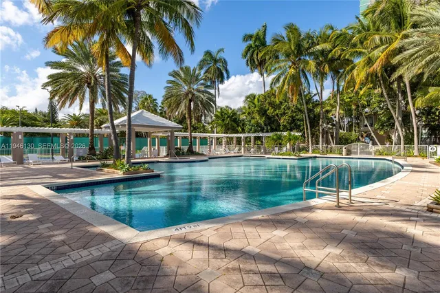 a view of a swimming pool with a patio