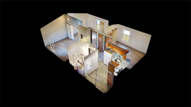 a view of living room with furniture and a clock