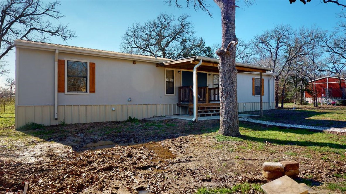 5585 Straub Road, Unit 110 College Station, TX 77845 - Photo 2 of 14 Manufactured / mobile home with a front lawn and a deck