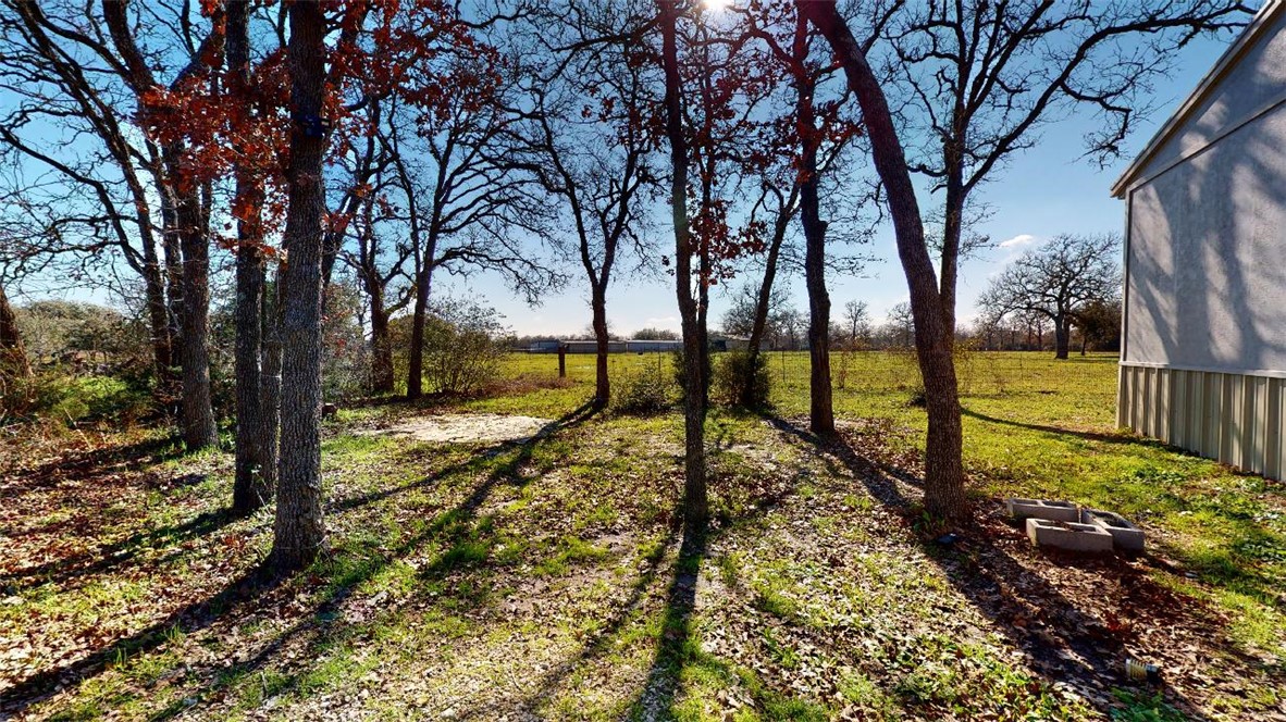5585 Straub Road, Unit 110 College Station, TX 77845 - Photo 3 of 14 View of grassy yard featuring a view of countryside