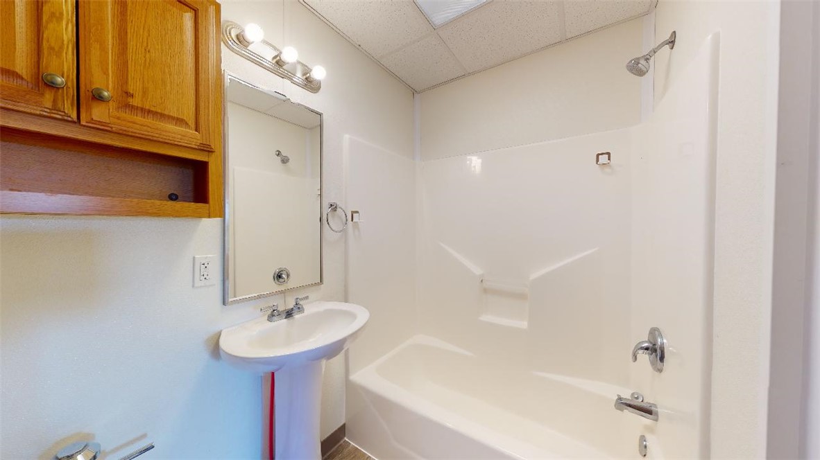 5585 Straub Road, Unit 110 College Station, TX 77845 - Photo 6 of 14 Full bathroom with shower / washtub combination and a paneled ceiling