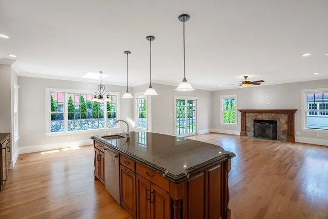 a kitchen with a stove sink and window