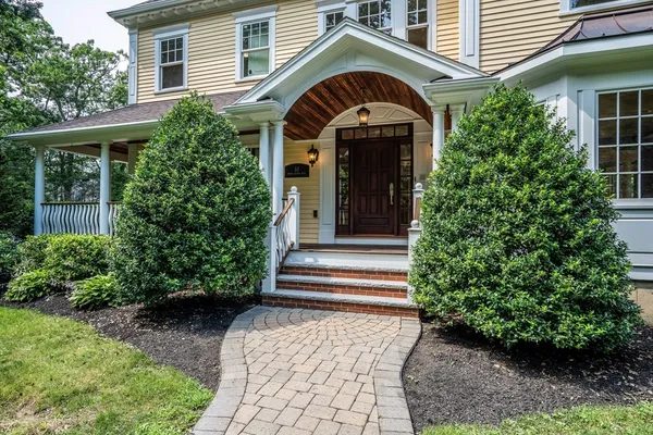 a front view of a house with a porch