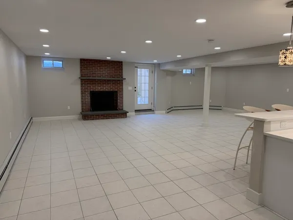 an empty room with an empty space and wooden floor