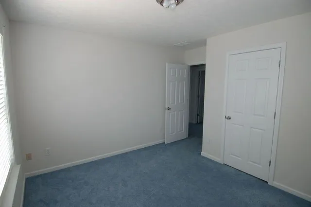 a view of hallway with closet