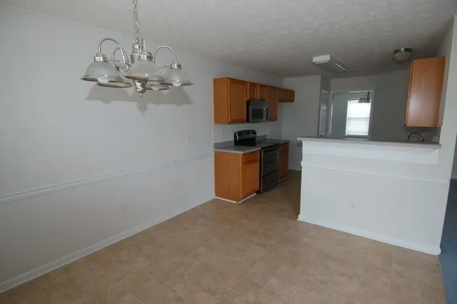 a view of a kitchen with a sink and dishwasher kitchen view