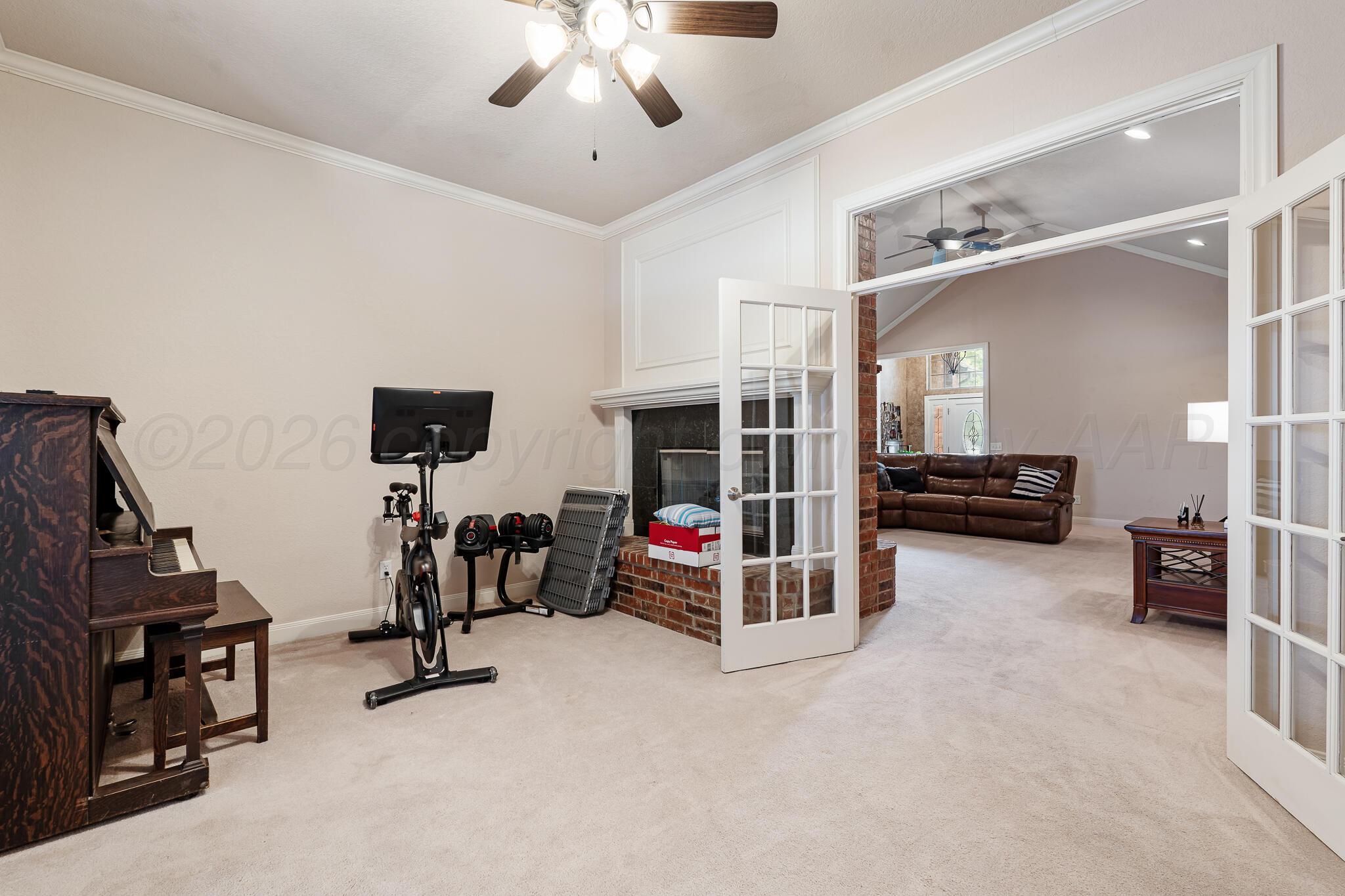 5008 Wesley Road Amarillo, TX 79119 - Photo 15 of 47 a view of a livingroom with furniture and a ceiling fan