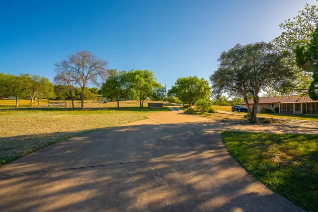 a view of a swimming pool with an outdoor space and seating area