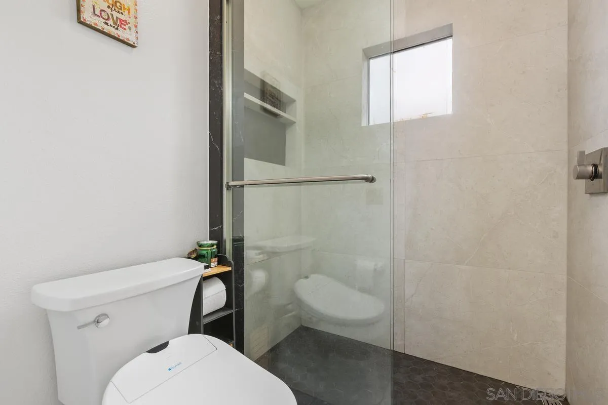 13847 Carmel Ridge Road San Diego, CA 92128 - Photo 23 of 40 a white toilet sitting next to a shower