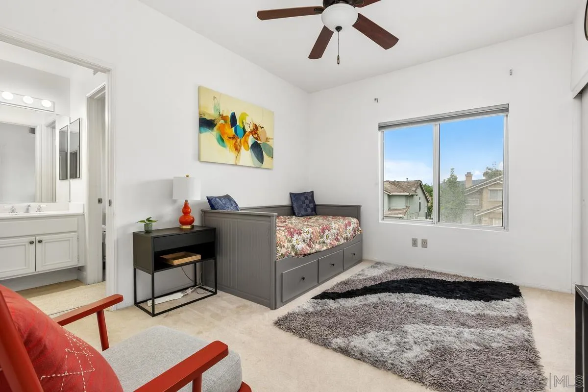 13847 Carmel Ridge Road San Diego, CA 92128 - Photo 24 of 40 a bedroom with furniture and a window